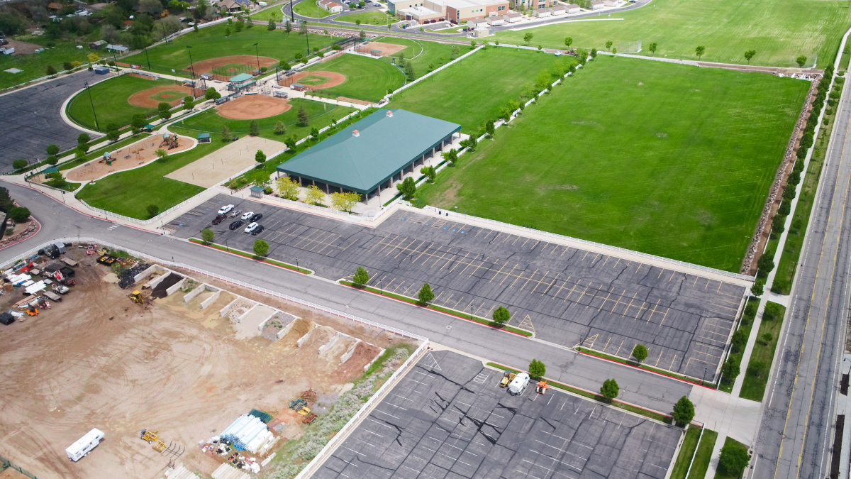 Students walking across a campus, representing education and long-term community growth in Herriman
